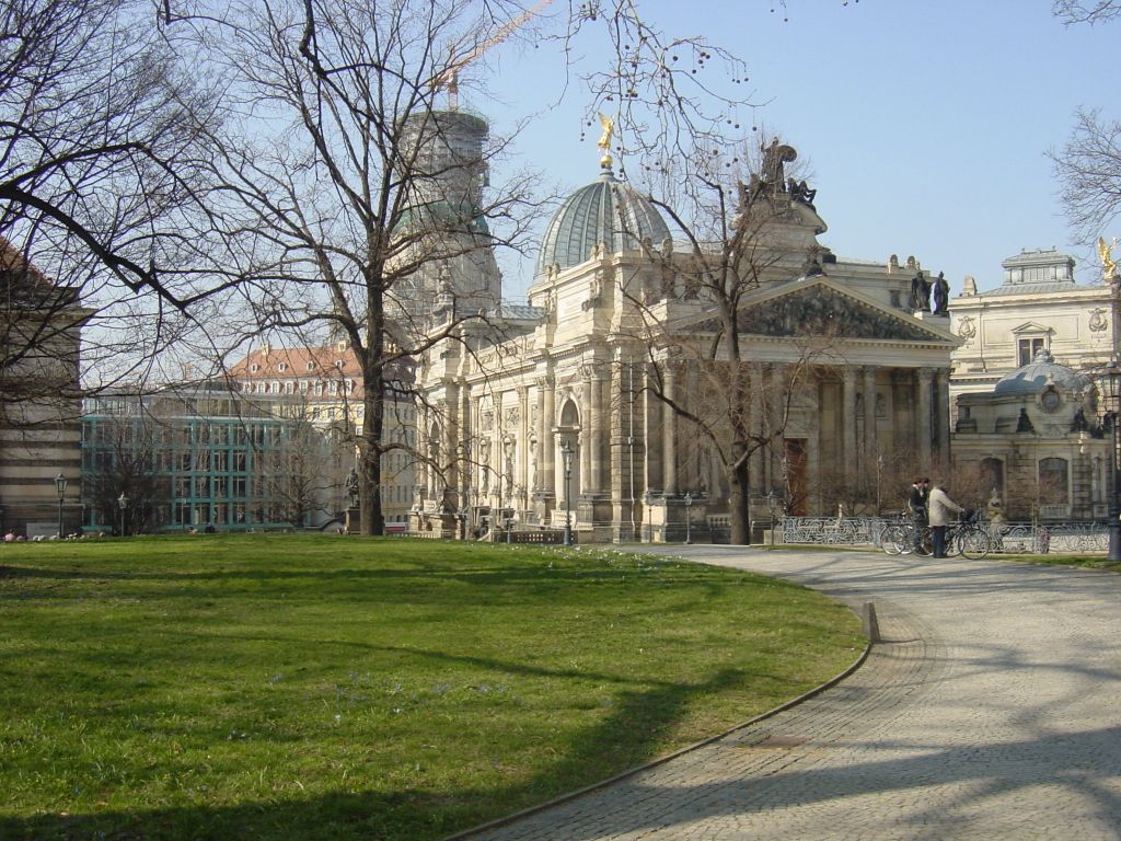 

Looking at the Albertinium, and the Frauenkirche in the background.
This whole thing I'm standing on used to be a moat and fortificatios.  
The moat was (at least, partially) filled in, and the fortifications covered
over, and a little park put on top.  The underneath is now a museum.  But 
much of the stuff on top (including trees) are on top of a big building 
that has empty space underneath.  Pretty neat.
