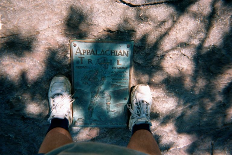 
My feet at the marker denoting the start of the AT
My shoes still look OK!  :-)
