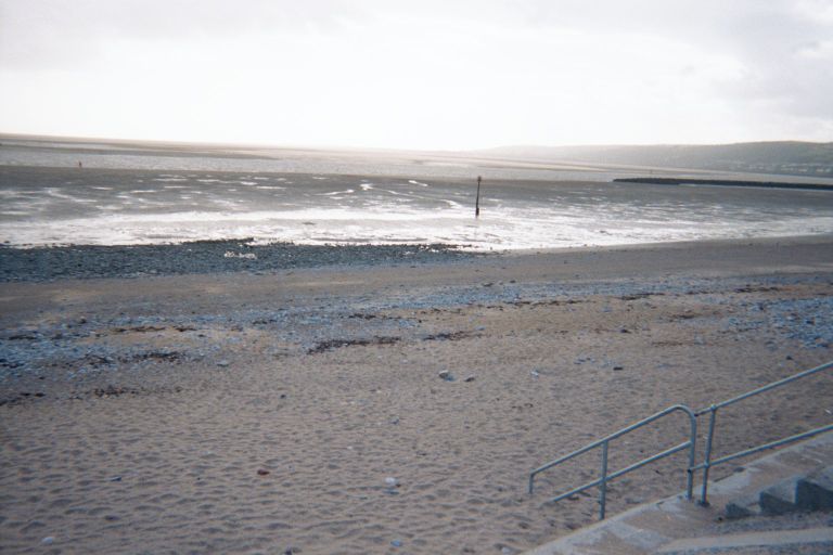 
The beach in Llanelli, which is pronnounced ``channechlee'' if you use the
``ch'' in ``loch''.  
